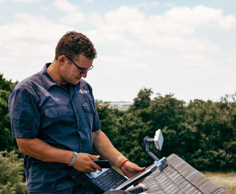 mercury technician standing on roof