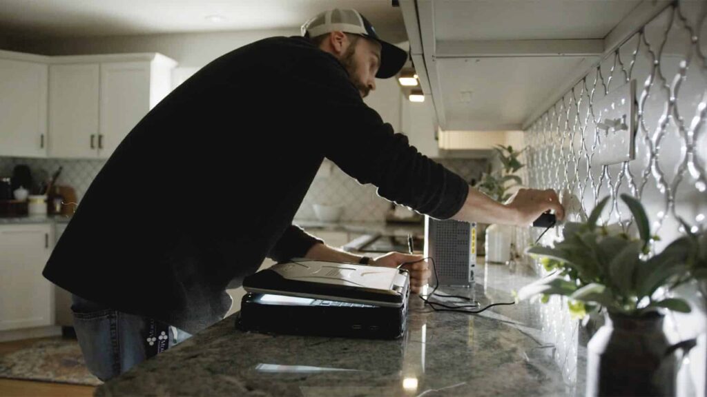 mercury installer working in kitchen setting