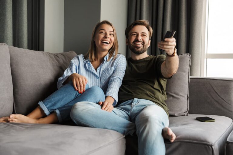 Couple watching TV on couch