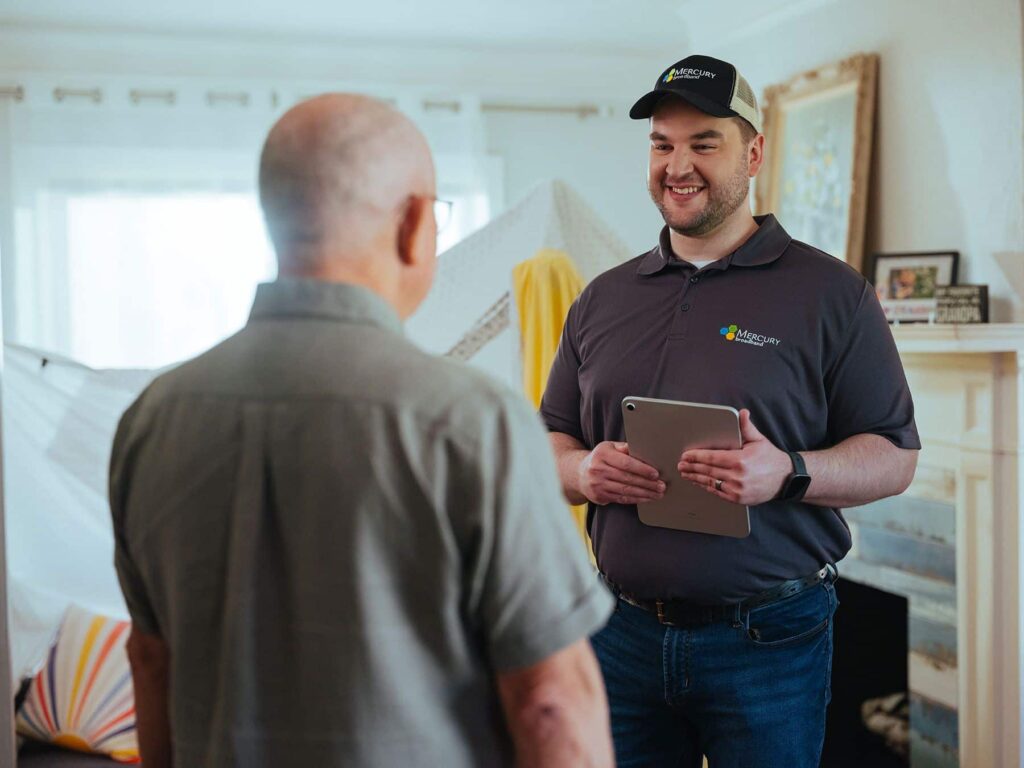 Mercury service technician discussing home internet services