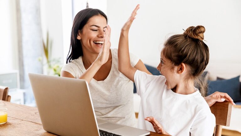 woman and child high fiving