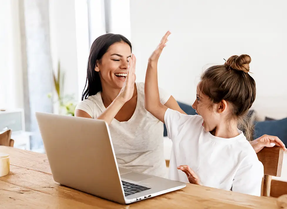 woman and child high fiving