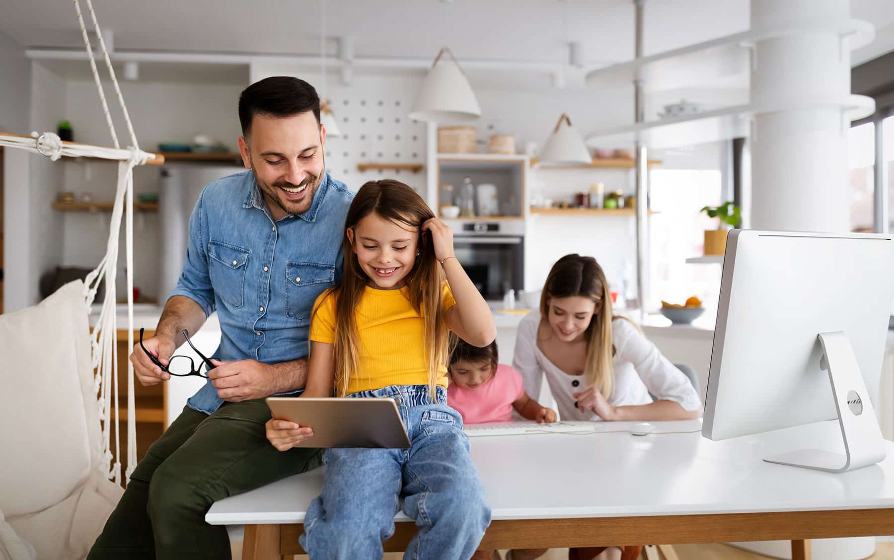 Family with computer and tablet