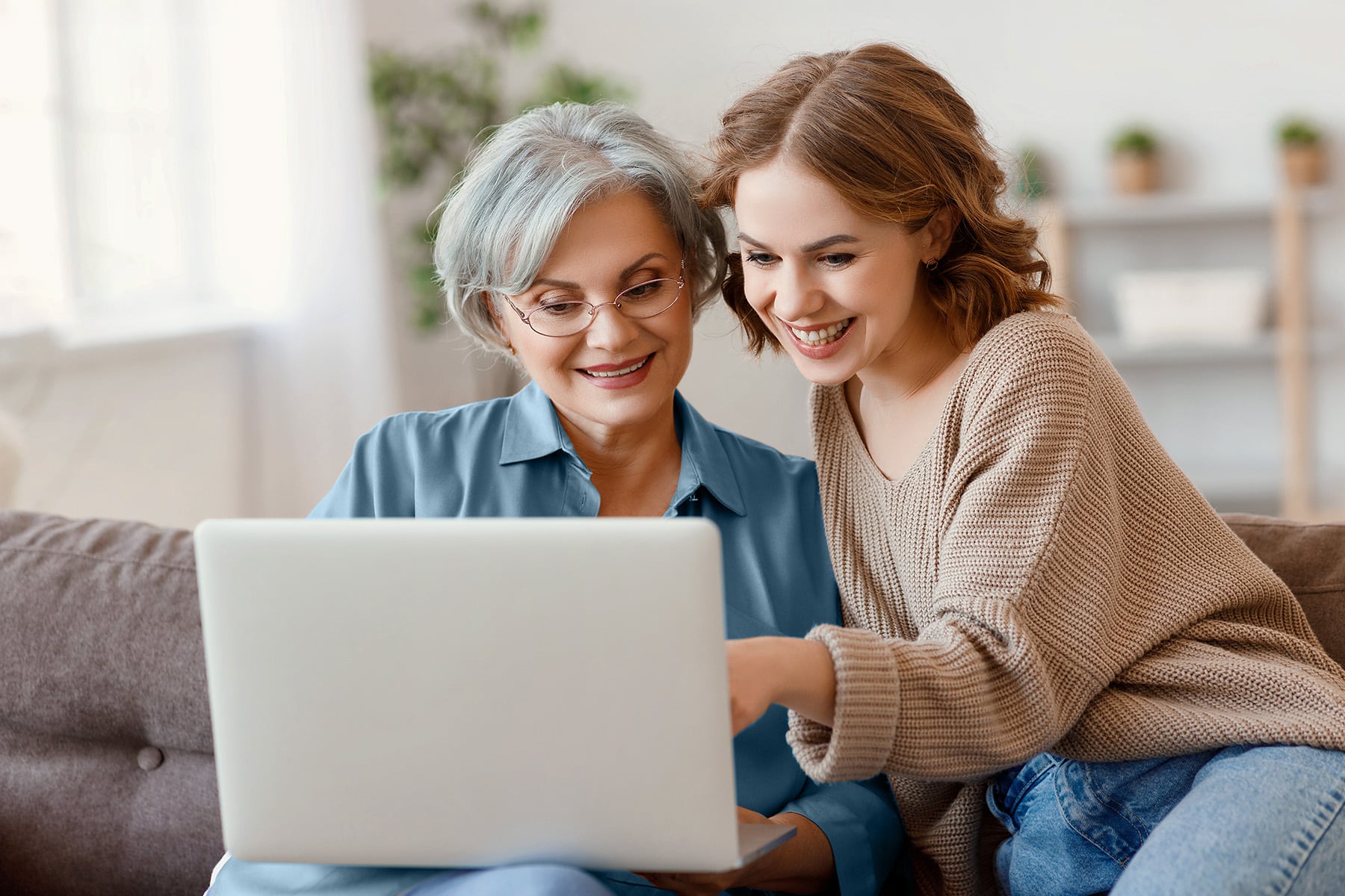 Mother and daughter with a laptop